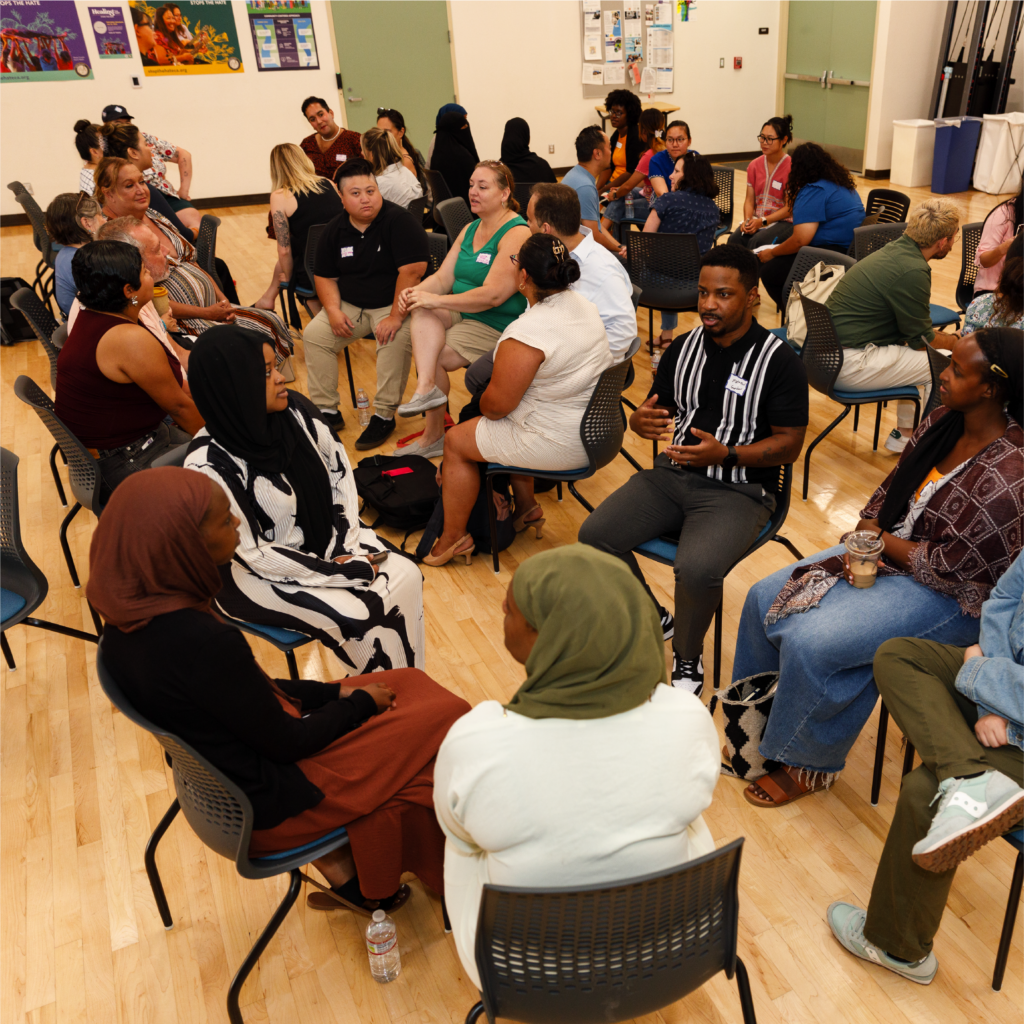 Groups of people sitting on circles and having conversations