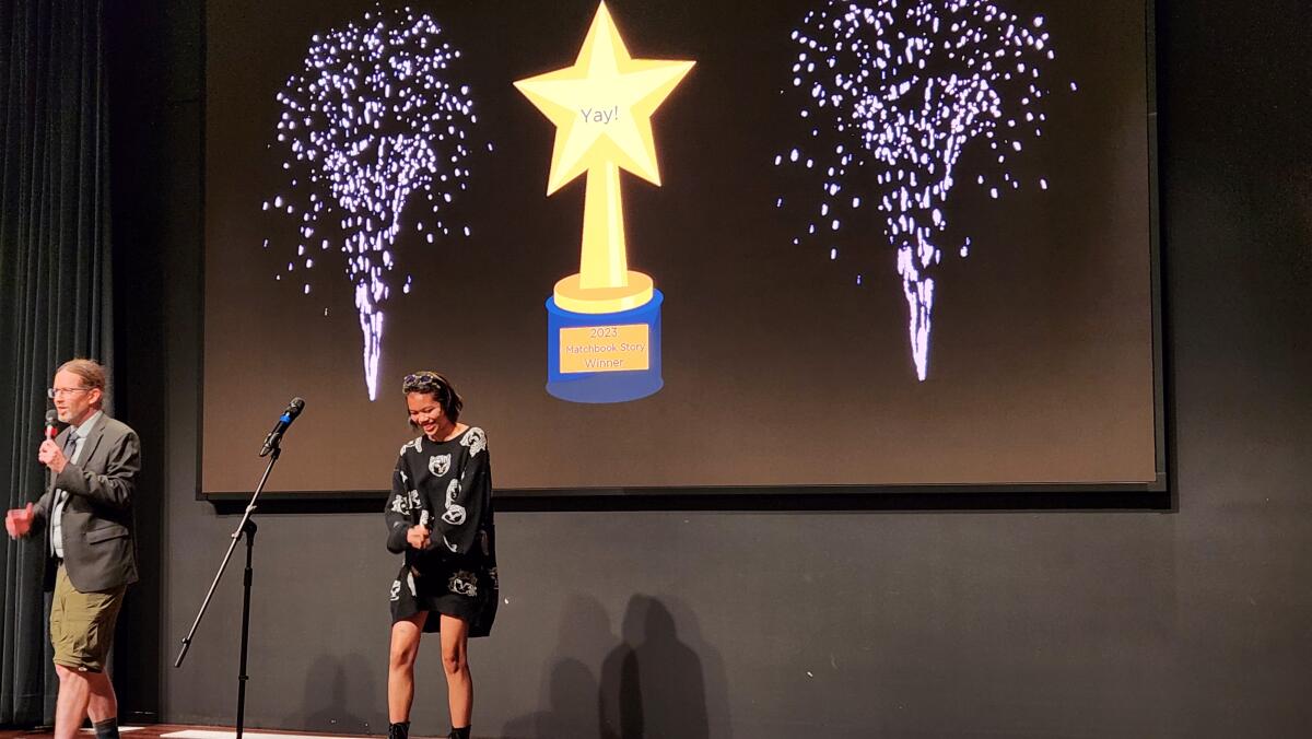 Winner Isabella Gutierrez accepts her Matchbook Story Contest award 